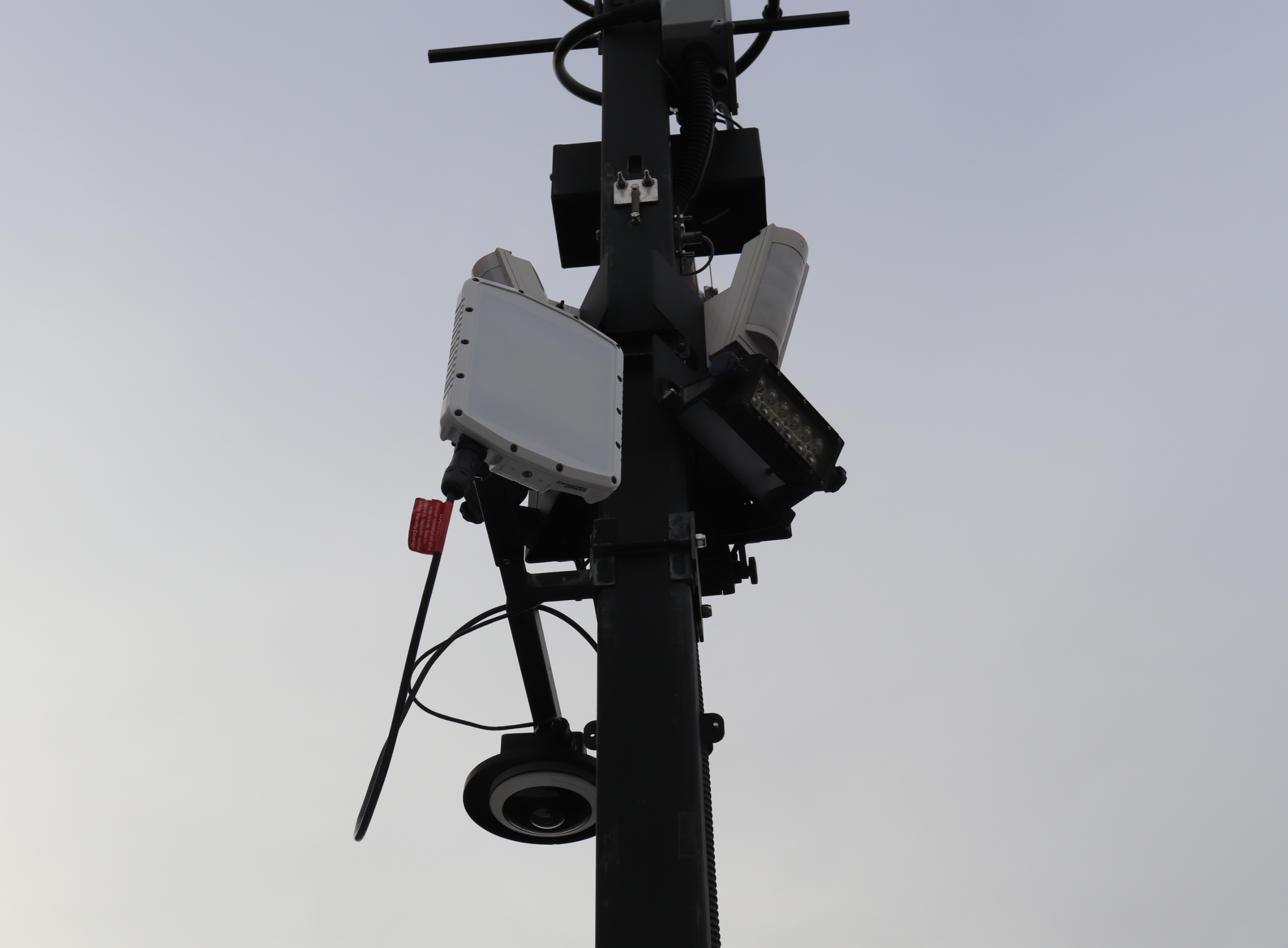 A Spotter Global radar is mounted alongside loudspeakers, cameras, and floodlights on an MPS trailer