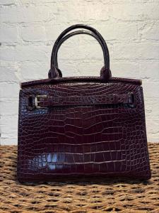 Ralph Lauren RL 50 Bordeau medium bag that sold for $22,000, only lightly used. Estimate: 12,800-$21,000