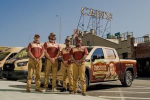 Maston's team members standing in front of service vehicle.