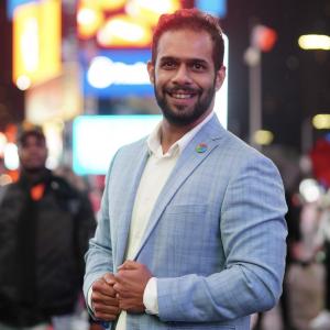 Portrait of Amith Kumar, public-sector AI leader, known for deploying generative-AI solutions like SAIGE for citizen engagement and government modernization.