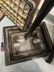 Cleaned grease trap after professional maintenance in a San Bernardino restaurant, ensuring clear flow and compliance with county FOG regulations.