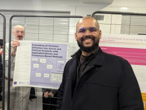 An image of Swaptik Chowdhury in front of his poster presented: "Shaping an Adaptive Approach to Address the Ambiguity of Fairness in AI: Theory, Framework, and Case Studies" to the Participatory AI Research Symposium, Paris 2025