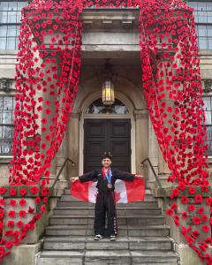 Team Canada athlete Eli Cooper at the Niagara-on-the-Lake Court House poppy project, paying tribute to those who have served.