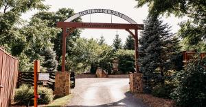 The Boulder Crest Welcome Sign Arcs above the main retreat entrance with the words "Welcome Heroes".