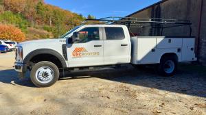 New WNC Roofing Commercial Roofing Service Truck with flat bed and lots of toolbox space for supplies and materials.