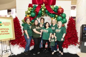 Group photo of women and children enjoying the Southern Christmas Show