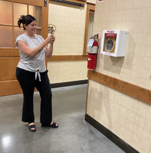 Cardiac Crusade volunteer, Danielle Piantedosi, mapping an AED