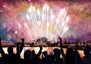 Crowds cheer by the waterfront as vibrant fireworks burst above Universal Studios Japan, lighting up the night sky over the park’s roller coasters and lagoon during the New Year countdown celebration.