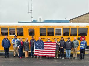 Durham School Services team members John, Terry, Bruce, Martian, and Rodney wearing their vests and joined by the Indian River Durham team and Indian River Central School District staff.