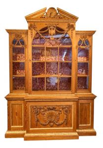 Magnificent late 18th century English Chippendale breakfront fashioned from superb pine, with a broken arch centered by a shell, 94 ½ inches tall by 68 inches wide. Estimate: $5,000-$10,000.