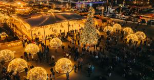 Christkindlmarkt guests ice skate and enjoy cozy warm igloos during the evening.