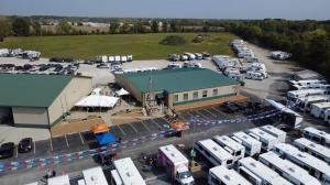 View of Stellhorn RV & Camping Center sales building, lot, inventory, and service bays from drone.
