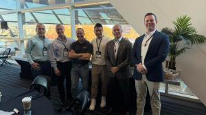 Group photo of Zen Koh standing with other participants at Collaborative Robotics Leadership Roundtable, Robotics and AI Discovery Day 2025, Pittsburgh