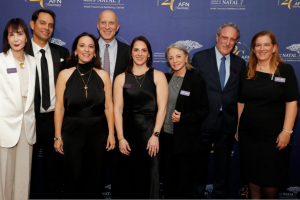 Group of people dressed up on a red carpet