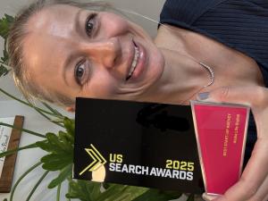 Claire Ransom holding Best Startup trophy from US Search Awards