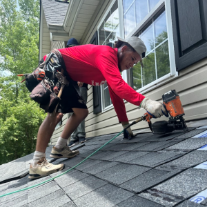 Triumph Roofing team performing a full roof replacement on a Charlotte home.