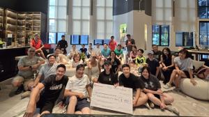 : Group photo of Kerry Guo and Step Up for Empowerment walk participants at Robotimize Group Singapore headquarters