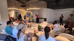 Kerry Guo delivering speech on wellness and rehabilitation to Step Up for Empowerment participants at Robotimize Singapore headquarters