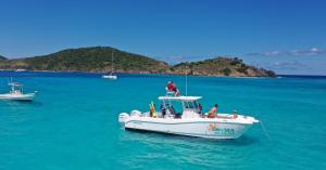 Guests aboard On The Sea Charters’ Gato Mundo enjoy turquoise waters and panoramic island views during a day trip through the U.S. Virgin Islands.