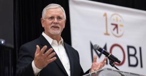 Photo of MOBI Executive Director Drew Starbird sharing remarks at MOBI's 10th Anniversary reception on November 11, 2025