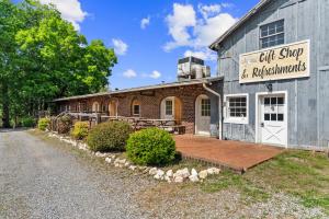 a 55.76 +/- acre parcel and a 17.71 +/- acre parcel offered individually and in the entirety of 73.47 +/- acres with a barndominium shell, chapel, country store and several other outbuildings/shop, 2 wells and 3 septic systems (one rated for 25 room hotel)