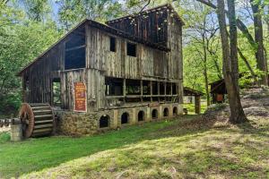 a 55.76 +/- acre parcel and a 17.71 +/- acre parcel offered individually and in the entirety of 73.47 +/- acres with a barndominium shell, chapel, country store and several other outbuildings/shop, 2 wells and 3 septic systems (one rated for 25 room hotel)