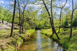 a 55.76 +/- acre parcel and a 17.71 +/- acre parcel offered individually and in the entirety of 73.47 +/- acres with a barndominium shell, chapel, country store and several other outbuildings/shop, 2 wells and 3 septic systems (one rated for 25 room hotel)