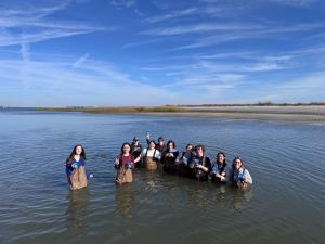 GSSM students collect Spartina alterniflora seeds along the marsh as part of the From Seeds to Shoreline environmental restoration project.