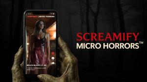 A smartphone held by a monster-like hand displaying a vertical horror scene of a blood-covered woman from Screamify’s Micro Horrors™ series; dark forest background with the Screamify Micro Horrors™ logo on the right.