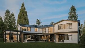 ARIID Build & Remodel contemporary home exterior with cream-colored walls, black metal roof accents, floor-to-ceiling glass doors, and integrated outdoor living spaces surrounded by mature trees.