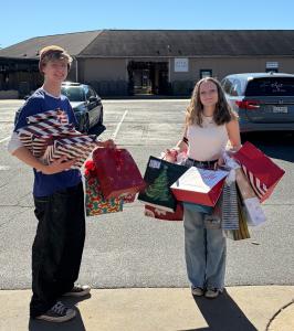 teens carrying Christmas gifts