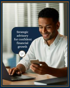 A professional reviewing data on a mobile device while using a laptop, reflecting Maano Capital’s focus on structured financial guidance.