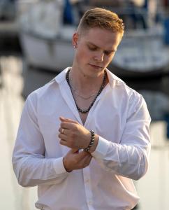Male model wearing new men's jewelry from Holly Zhang Pearl Gallery