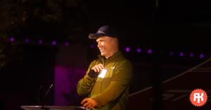 Ride Krew President Sean Bascom speaking to supporters at the inaugural fundraiser, highlighting the nonprofit’s mission to expand youth mountain biking programs and bike access in Southern California.