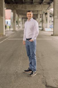 Headshot of Forrest Good, in Portland Downtown