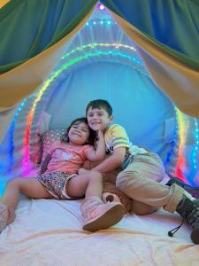 Picture of boy and girl in Burble tent.