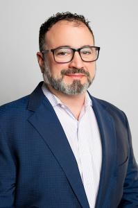 Portrait caption noting the individual as CEO of PreReal Investments and creator of The Prendamano Academy.