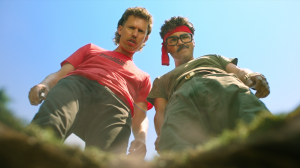 Jon Heder as Nate Skoog and Jay Pichardo as Will Luna in the film "Tapawingo," directed by Dylan K. Narang, streaming on December 2, 2025, across all major TVOD platforms including Apple TV, Prime Video, and Vudu