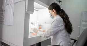 Laboratory extraction setup with technician verifying cannabinoid profiles for full-spectrum CBD products.