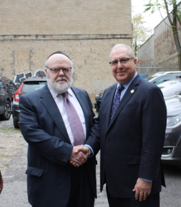 Dr. Joshua Weinstein (left), Assemblyman Steven Cymbrowitz (right) outside of SKHOV