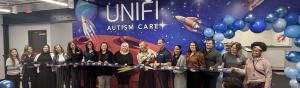 UNIFI Autism Care team holding the ribbon to celebrate our opening