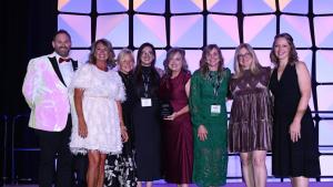 Kentucky Bluegrass Region Members Presenting the "Best In Show" award on stage at the KTIA Fall Conference