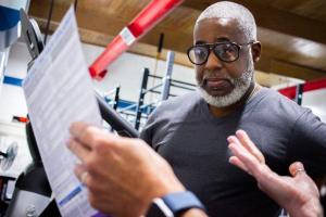 A man reads the results of an EVOLT 360 body composition scan.