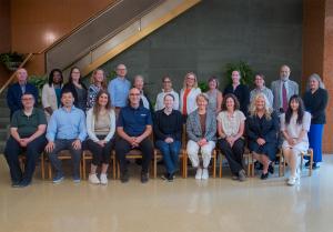 Large group of volunteers as a seated/standing group shot, at the ICVA Communications Skills Meeting in June.