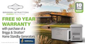Briggs & Stratton Promotional. A curving stone walkway leads to a modern home with floor to ceiling windows. A few fall leaves are on the grass. In the background, a hill is covered with trees wearing fall colors. Foreground are two Briggs & Stratton Stan