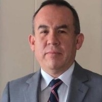 Professional portrait of Carlos Alcides Ramirez, CEO of INTSY LLC